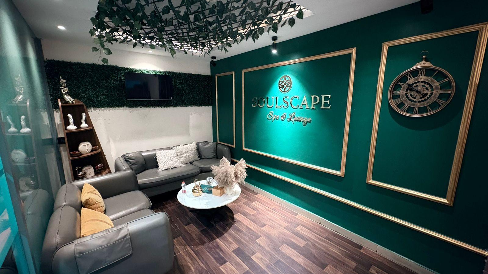 Emerald lounge with the gold Soulscape logo at Jubilee Hills