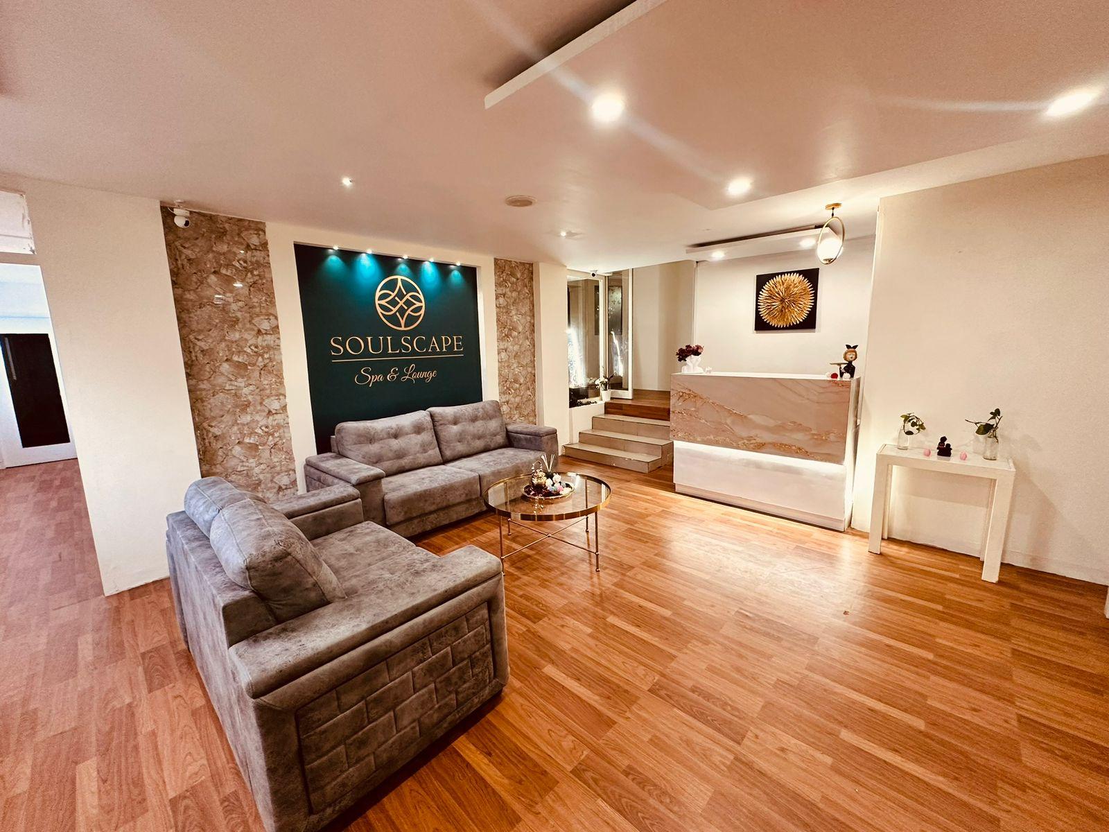 Lounge with the Soulscape logo wall at Somajiguda